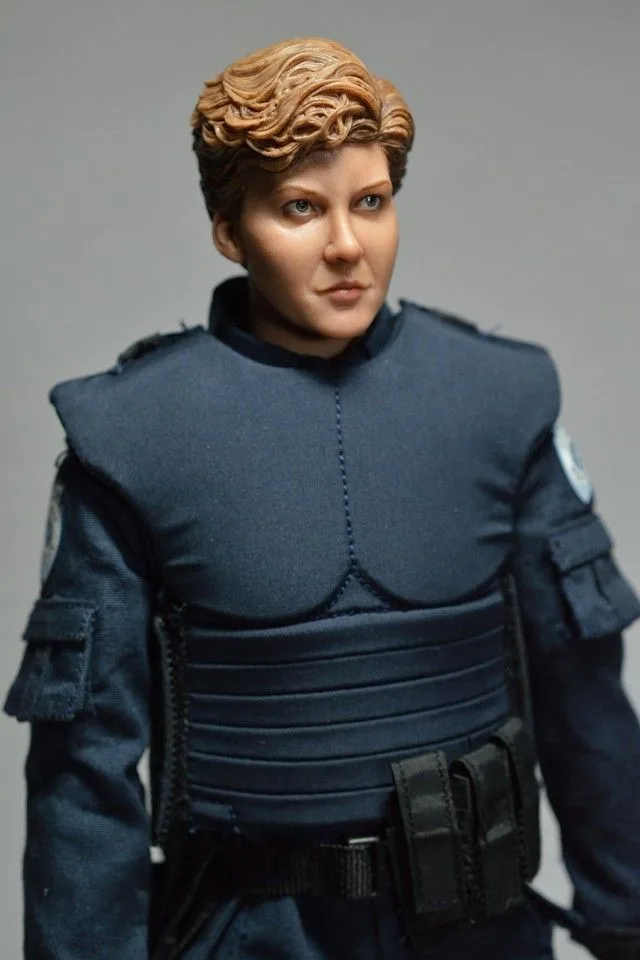 Three-quarter view of the custom Anne Lewis figure showing the fitted police vest, sleeve pockets and equipment belt.