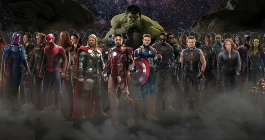 Marvel movie-character montage with Hulk above a lineup including Thor, Iron Man, Captain America, Hawkeye and Black Widow.