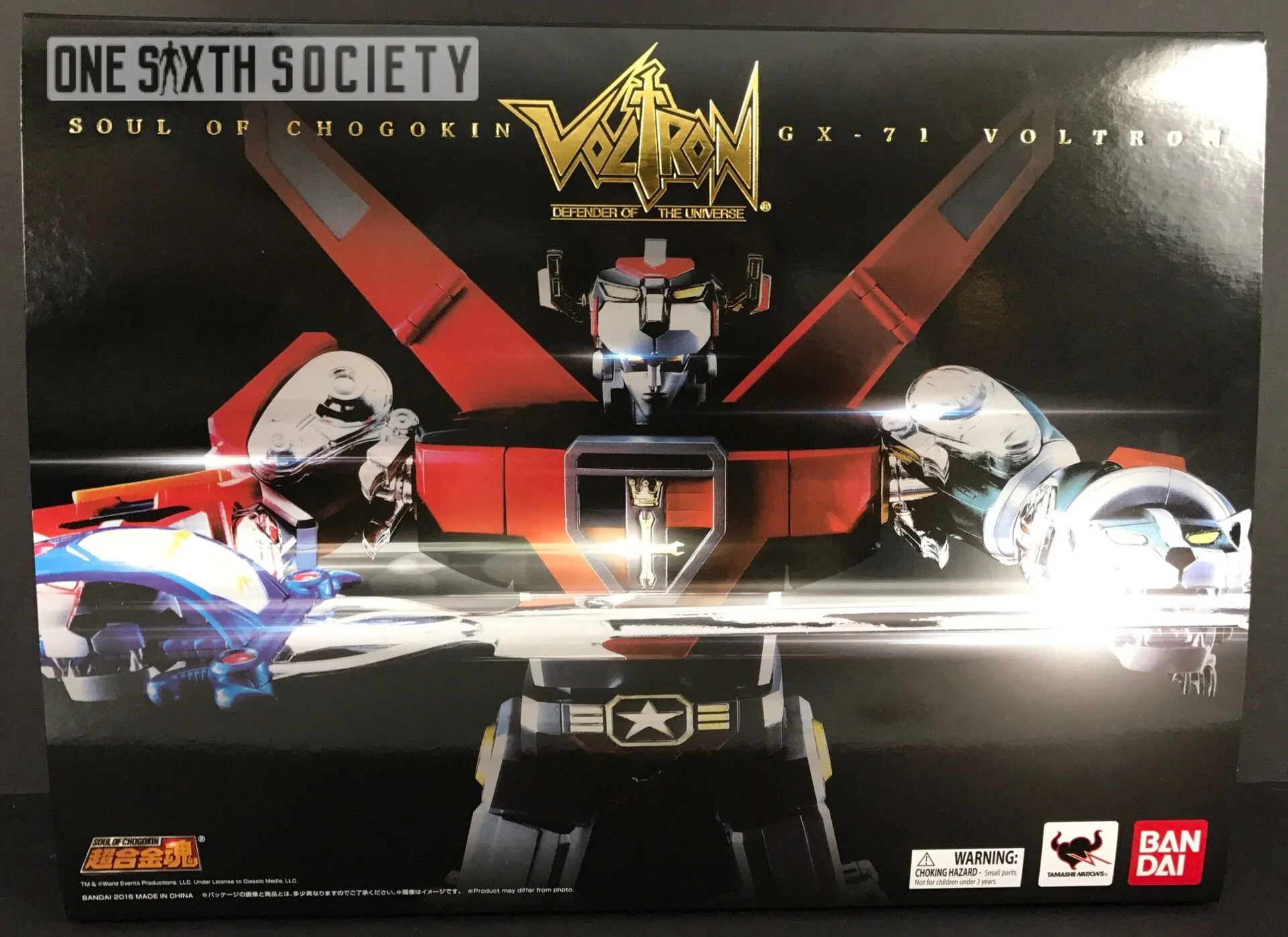 Front of the Bandai Soul of Chogokin Voltron GX-71 box, with colorful Voltron artwork, a large sword and the red Bandai logo.