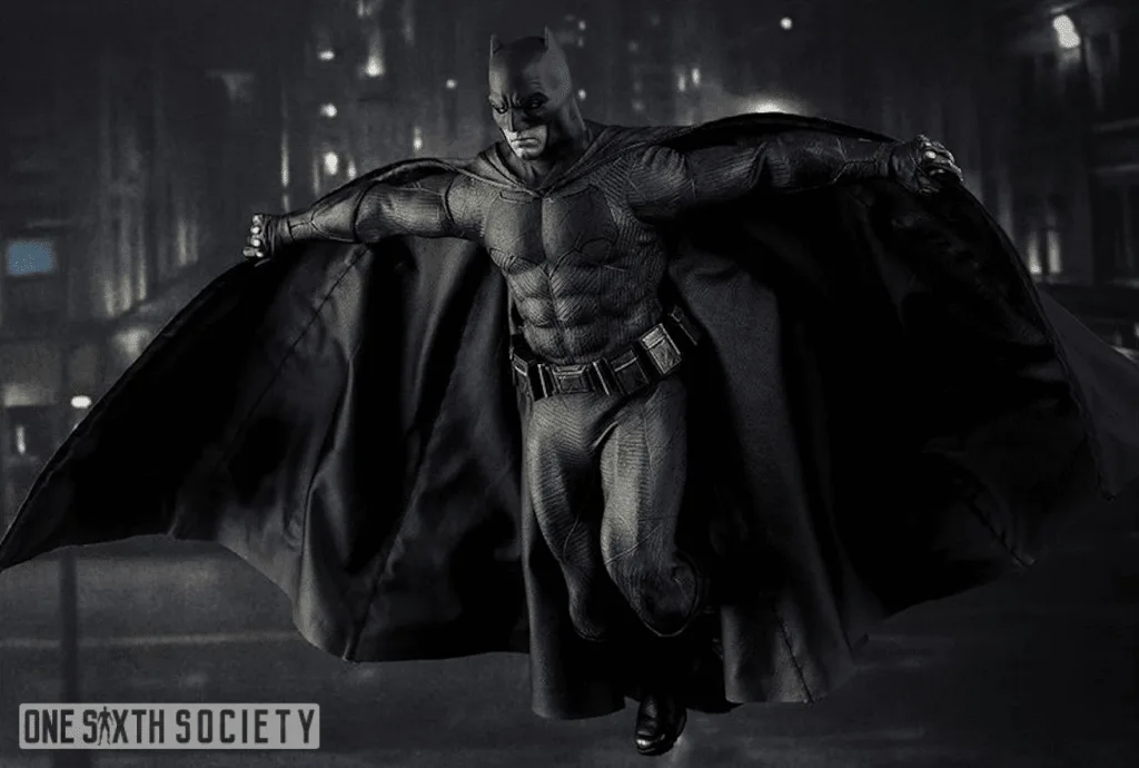 Hot Toys Suicide Squad Batman suspended with arms spread, knees bent and his black cape extended on both sides.