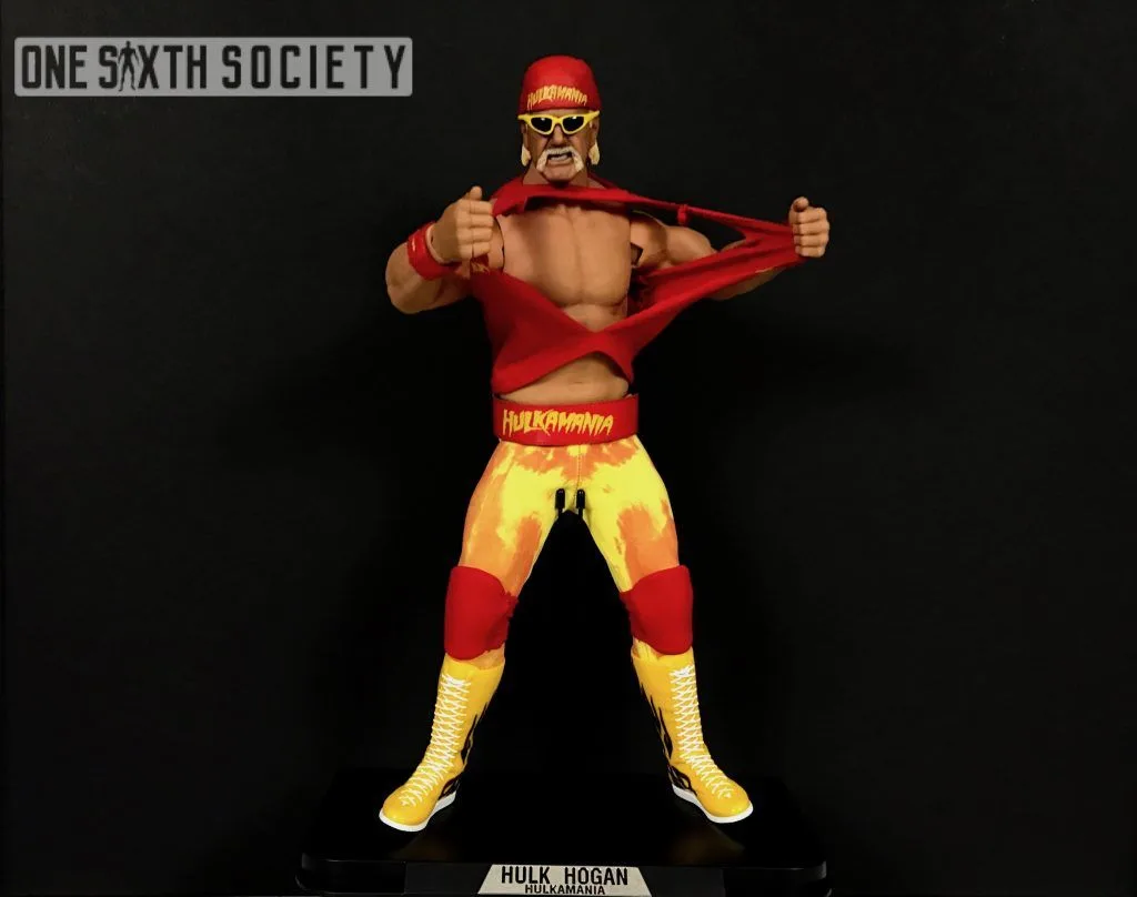 Storm Collectibles Hulk Hogan figure pulling his red shirt open, wearing yellow sunglasses, patterned tights and tall yellow boots.