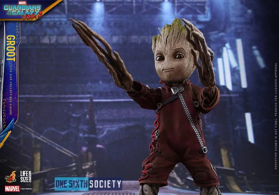 Hot Toys Baby Groot wearing a burgundy Ravager outfit with long branch-like hands raised in front of him.