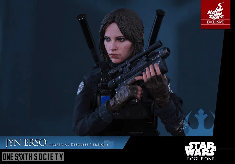 Hot Toys Jyn Erso figure holding a black blaster across her chest while looking to the side in her Imperial disguise.