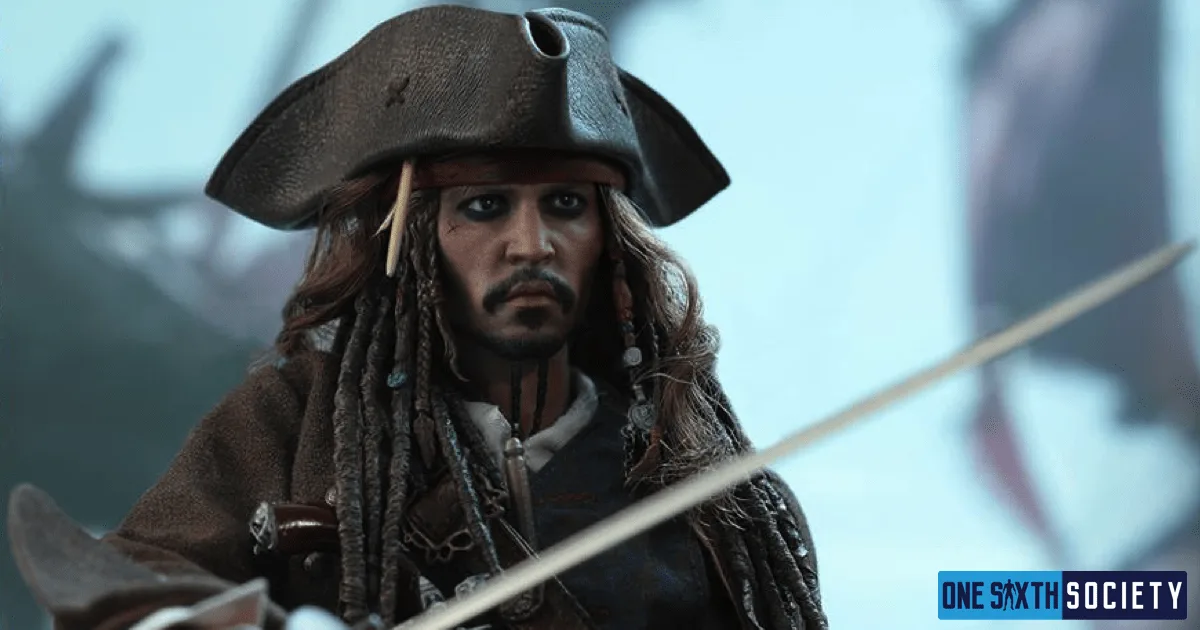 Hot Toys Jack Sparrow with a serious expression beneath his tricorn hat, a sword blade crossing the foreground.