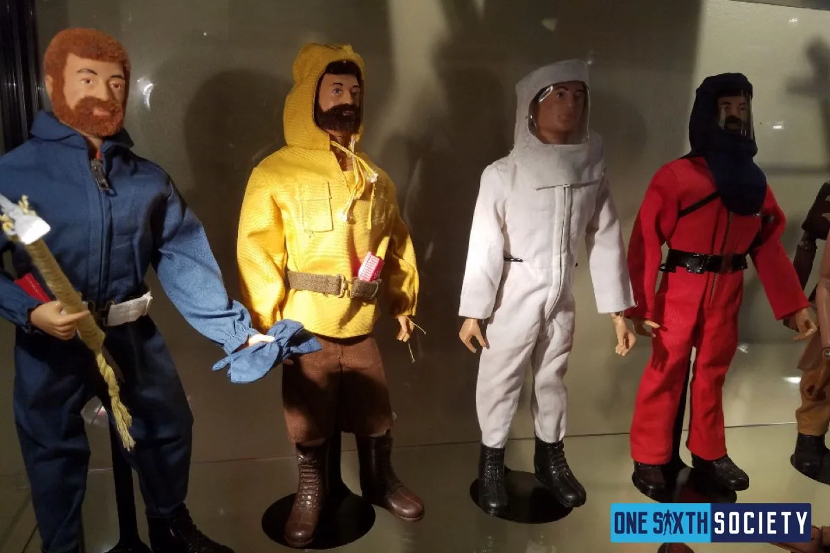Four G.I. Joe figures displayed in blue, yellow, white and red adventure outfits, with their belts and tools visible.