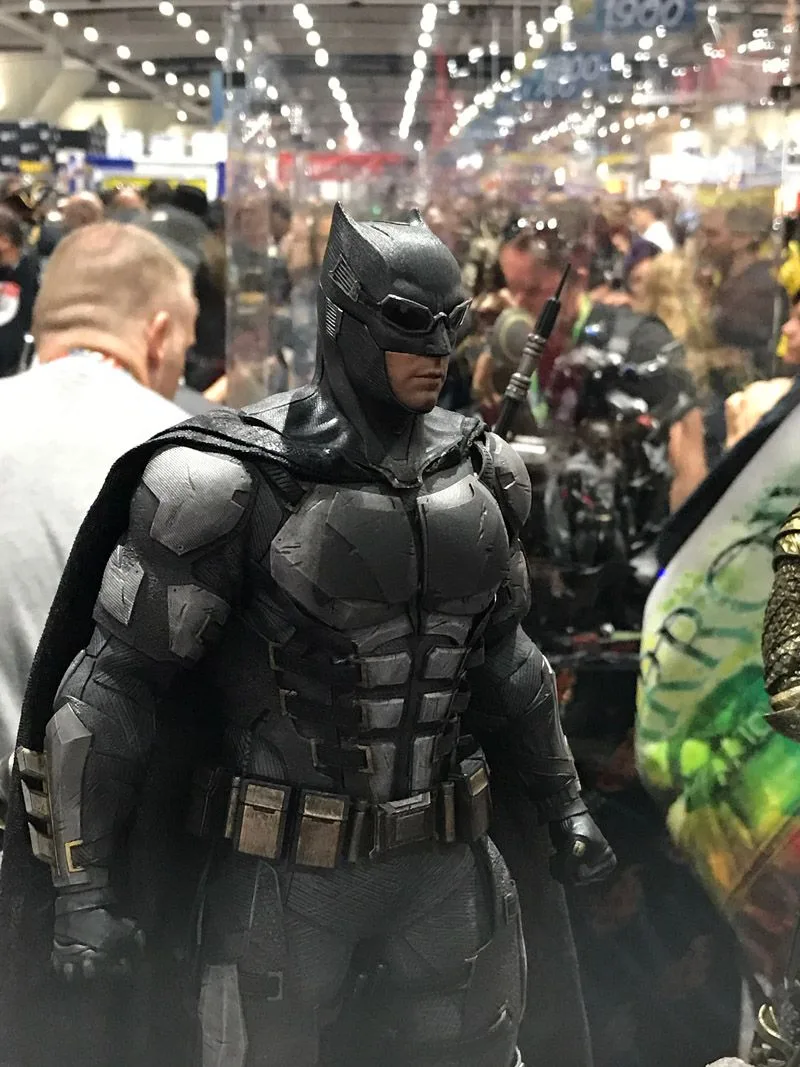 Hot Toys Batman wearing goggles over his cowl and segmented dark tactical armor, photographed from the waist up.
