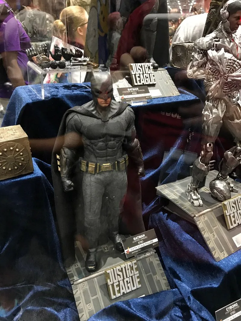 Hot Toys Batman standing on a Justice League base in a gray suit and black cape, with a gold utility belt and Cyborg beside him.