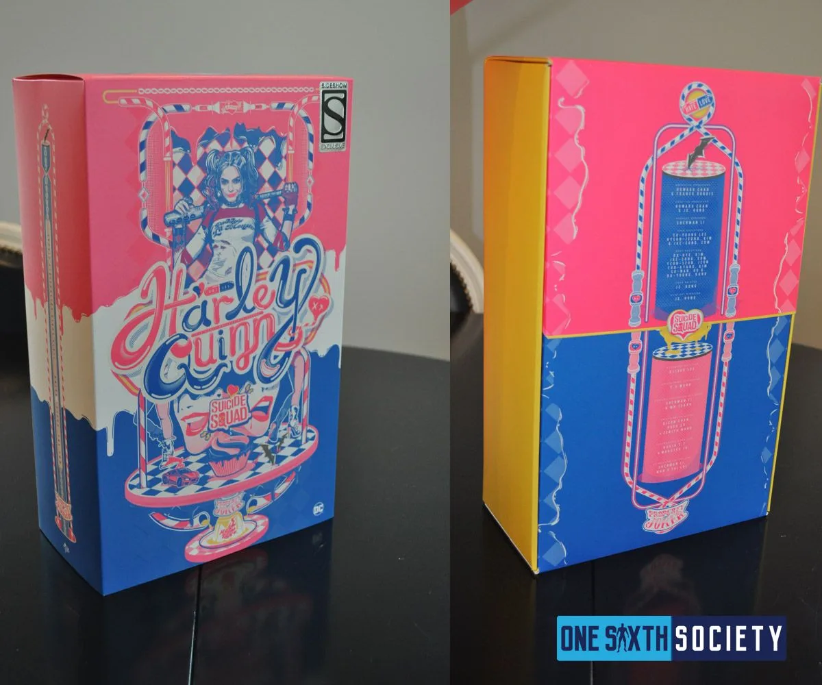 Front and back of the pink-and-blue Hot Toys Harley Quinn art box on a black table, with an exclusive-edition sticker.