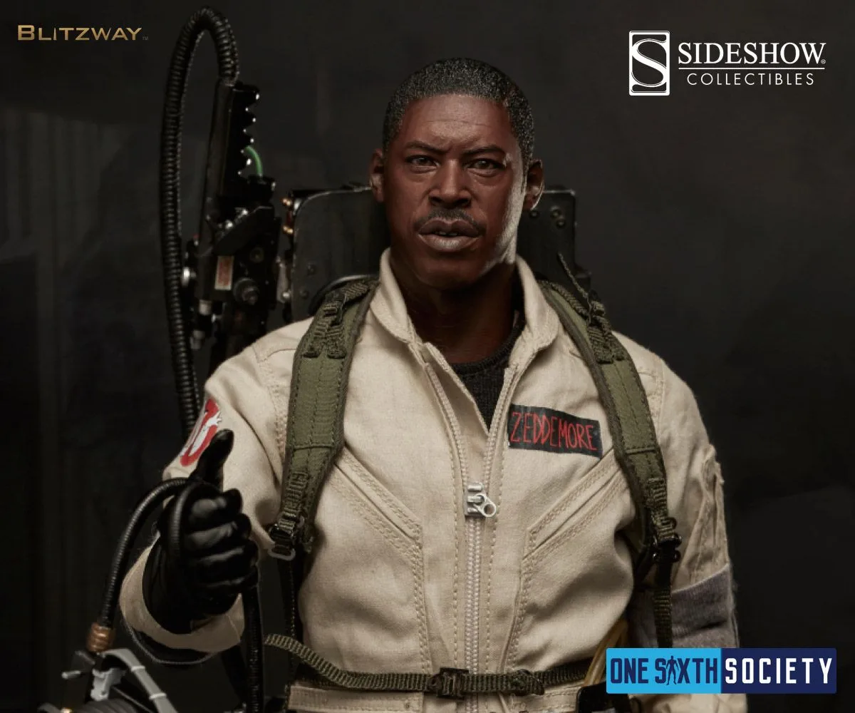 Winston Zeddemore figure wearing a beige Ghostbusters uniform and proton-pack straps, with one gloved hand raised.