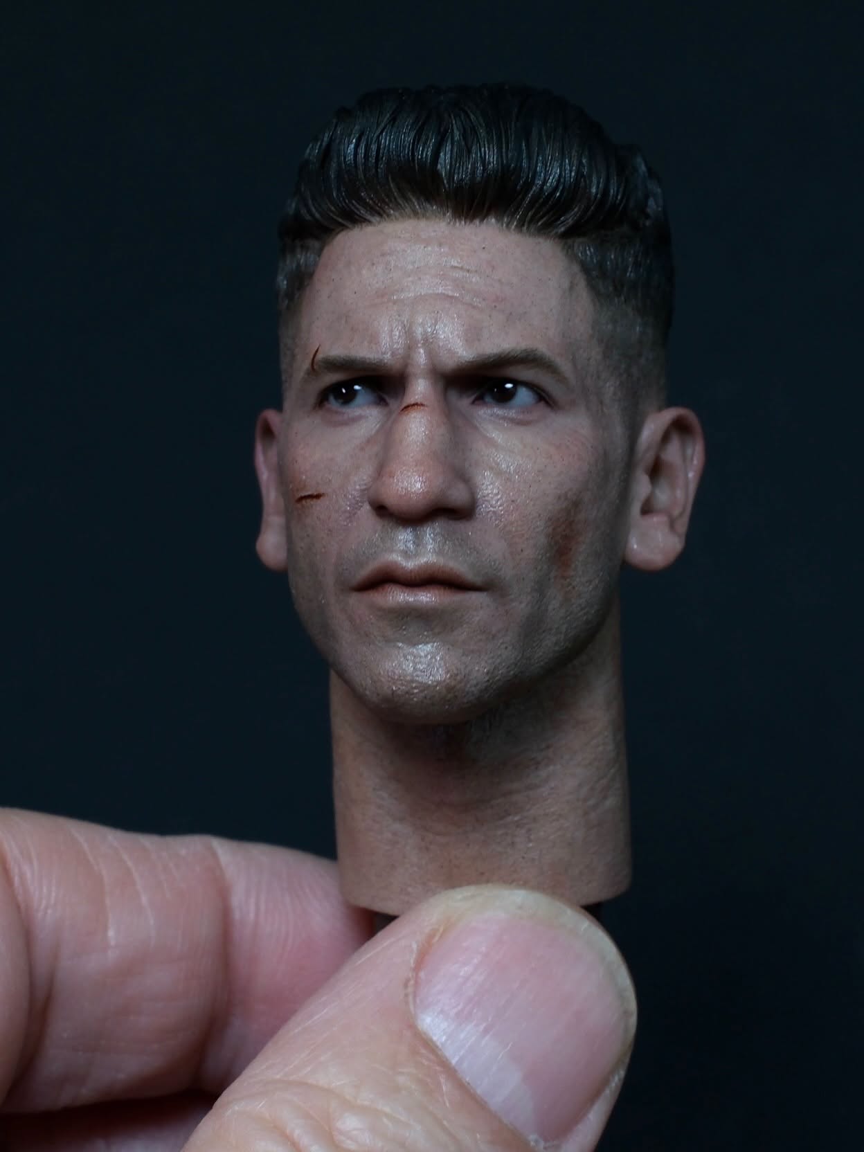 Punisher miniature head sculpt with facial scratches and stubble