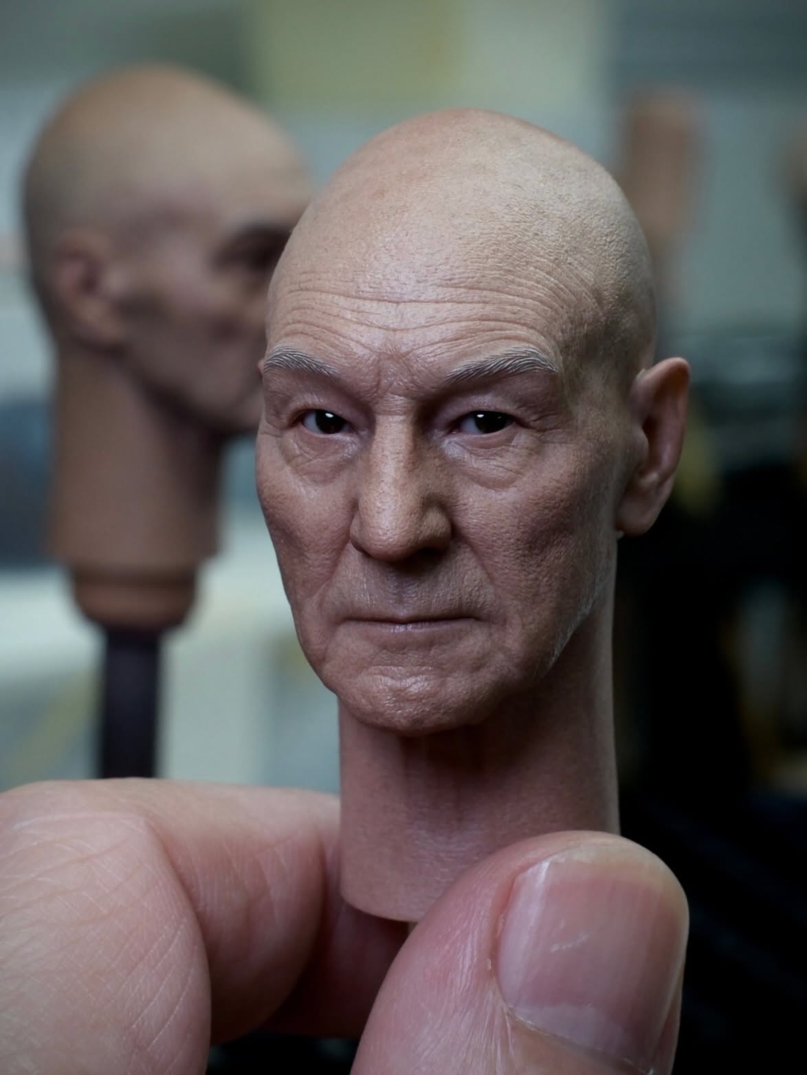 Professor X miniature portrait with fine wrinkles and painted skin texture