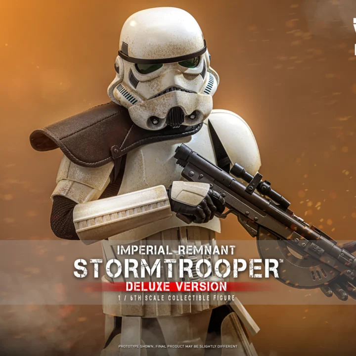 Hot Toys Imperial Remnant Stormtrooper wearing a black shoulder pauldron and holding a battery rifle across weathered white armor against a warm brown backdrop.
