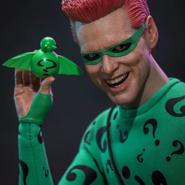 Jim Carrey Riddler head sculpt with green mask and a Bat-Bomb held beside his face