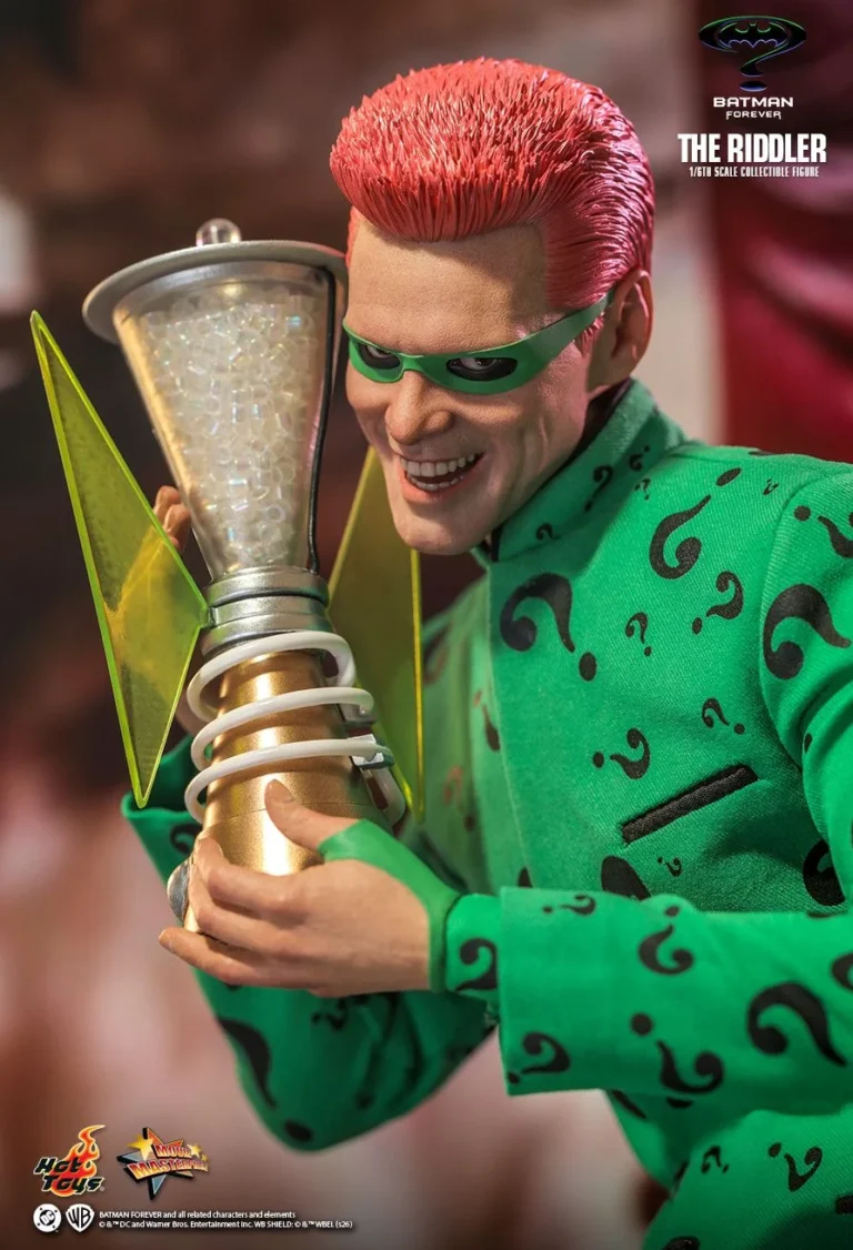 Riddler examining the NygmaTech main box with its green illuminated detail