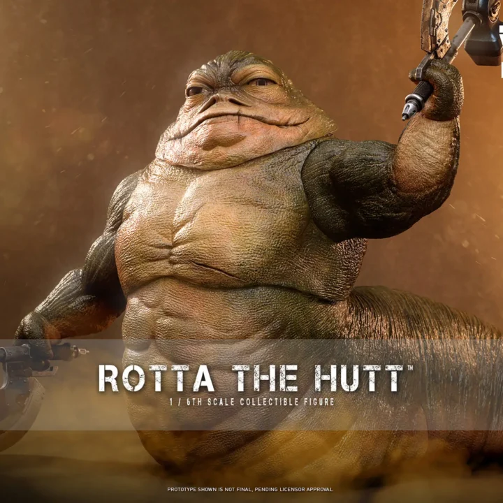 Hot Toys Rotta the Hutt raising one battle axe and holding the other low, with a broad muscular torso and long curled tail against warm lighting.