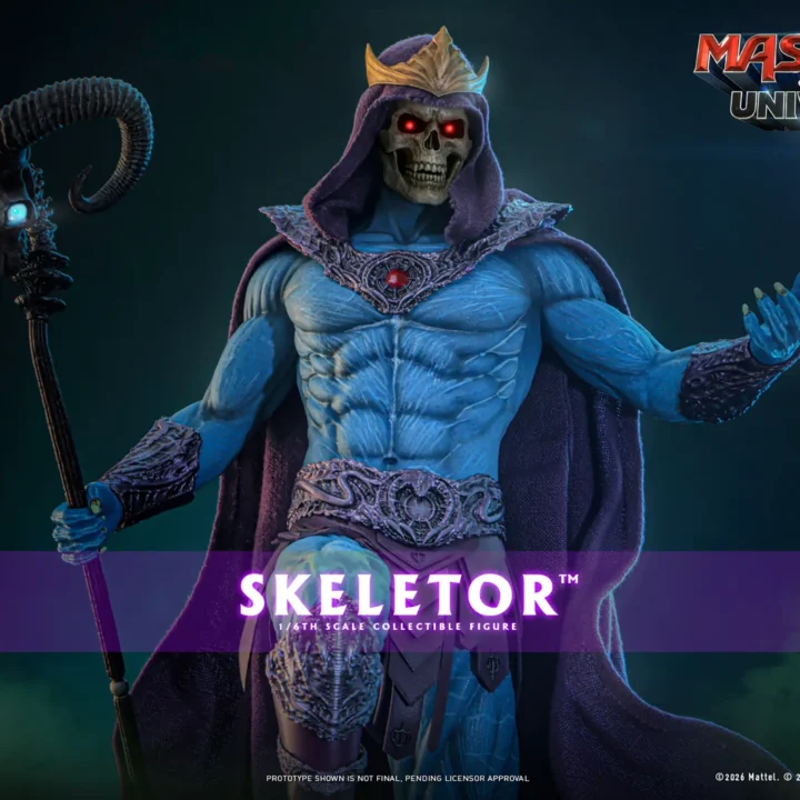Hot Toys Skeletor wearing a gold crown over a purple hood, with glowing red skull eyes, a blue muscular torso and the horned Havoc Staff beside an open hand.