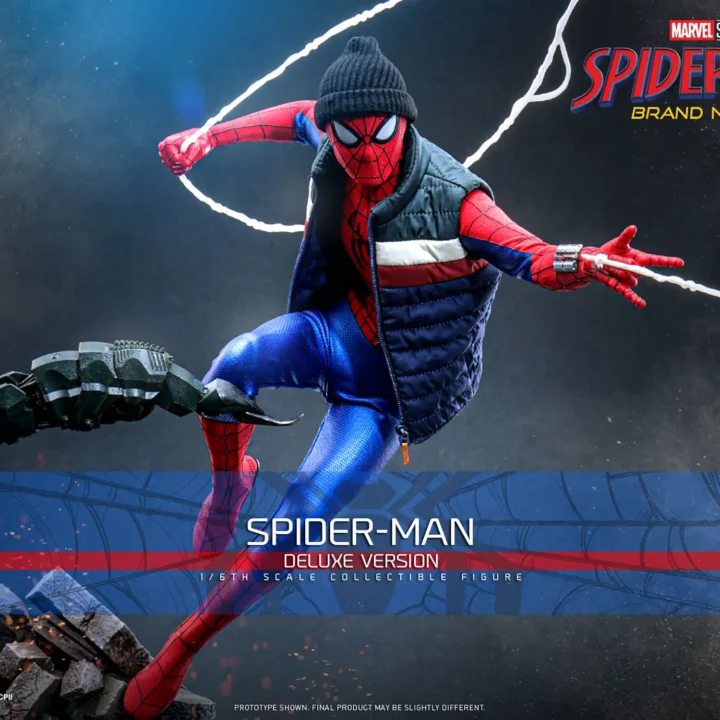 Hot Toys Spider-Man in a black beanie and striped puffer vest swinging white web lines above rubble and Scorpion's armored tail, with one knee raised.
