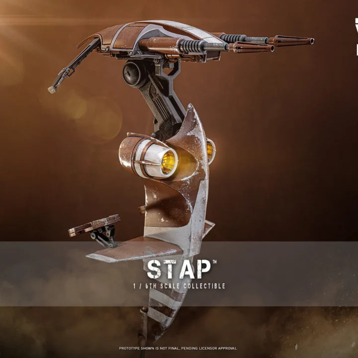 Hot Toys STAP vehicle in a three-quarter promotional view, showing the brown-and-gray weathering, twin upper guns and circular yellow-lit housings.