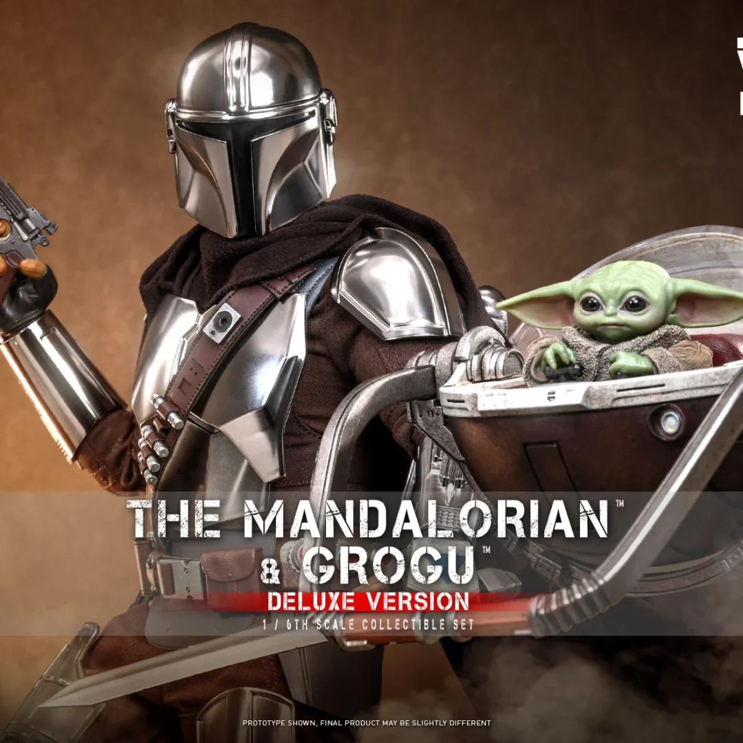 Hot Toys Mandalorian raising a blaster pistol beside Grogu seated in an open hover-pram, with polished silver armor and helmet against a warm brown backdrop.