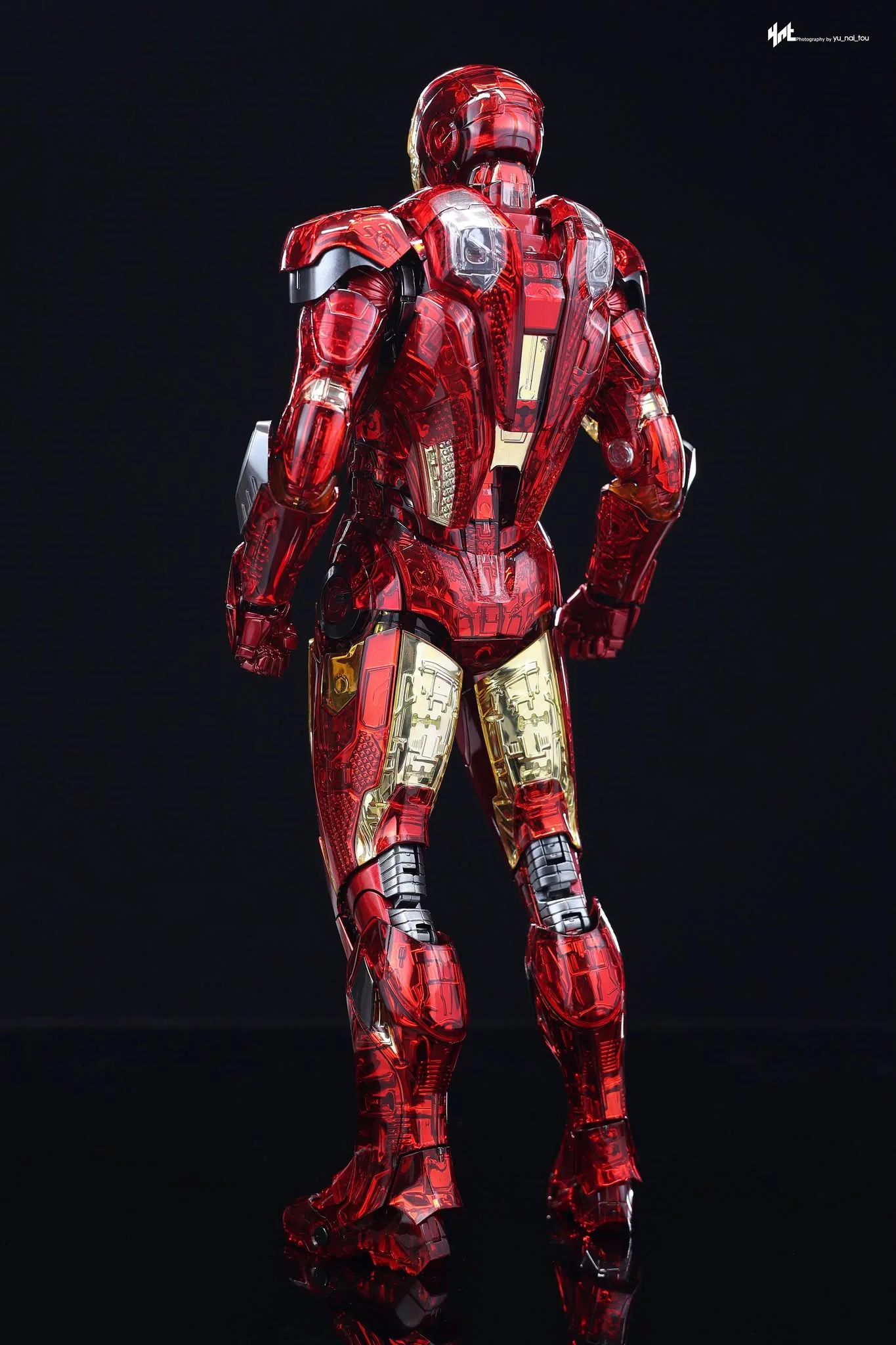 Final production review photo of Hot Toys Iron Man MK 7 Exo-Chrome showing the clear armor and mechanical detail from the back.