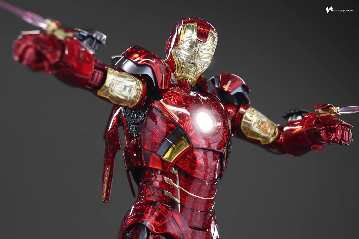Final production review photo of Hot Toys Iron Man MK 7 Exo-Chrome showing the raised repulsor hands and wrist armor.