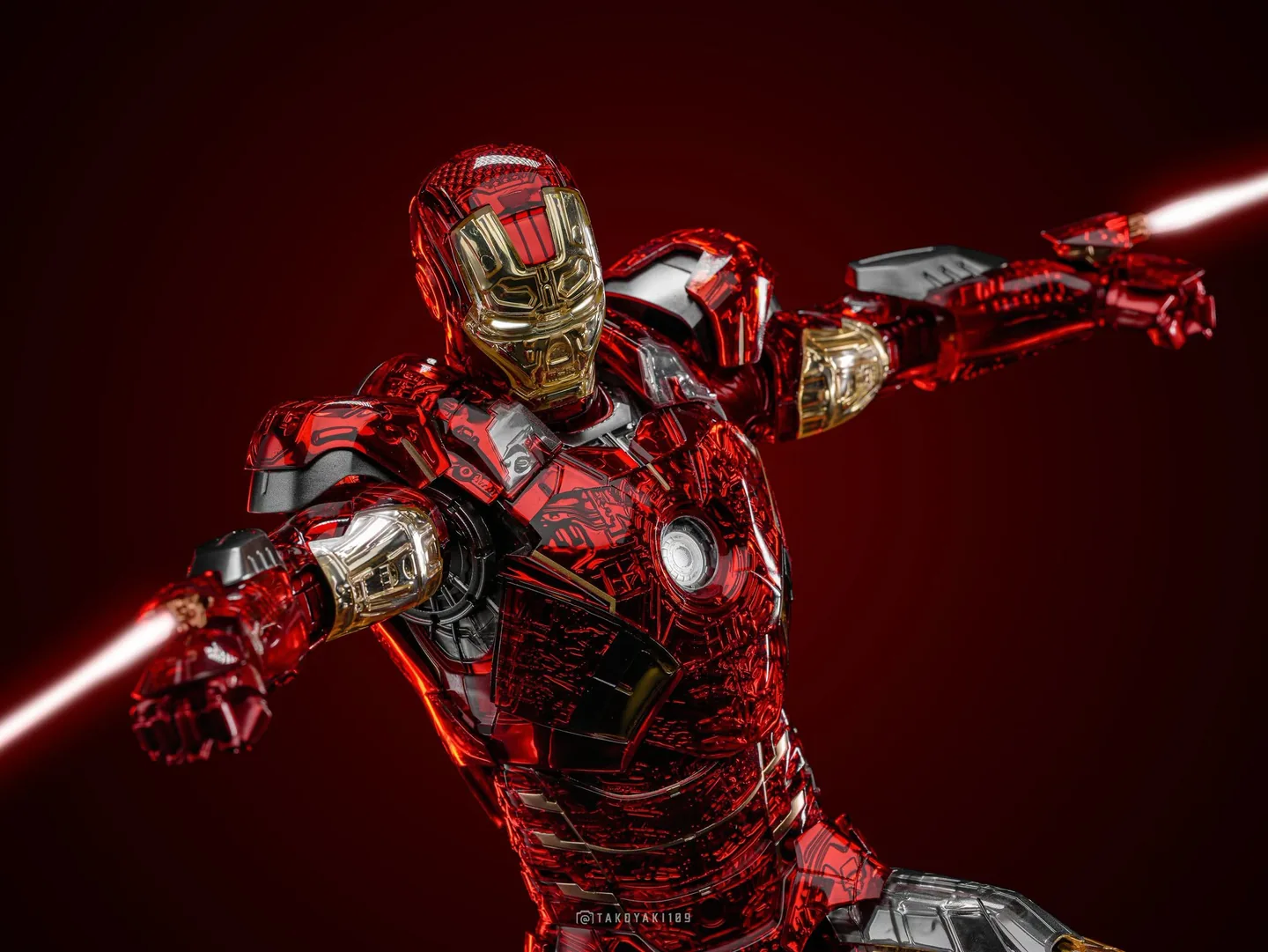 Final production review photo of Hot Toys Iron Man MK 7 Exo-Chrome showing the included laser effect parts fitted to the arms.