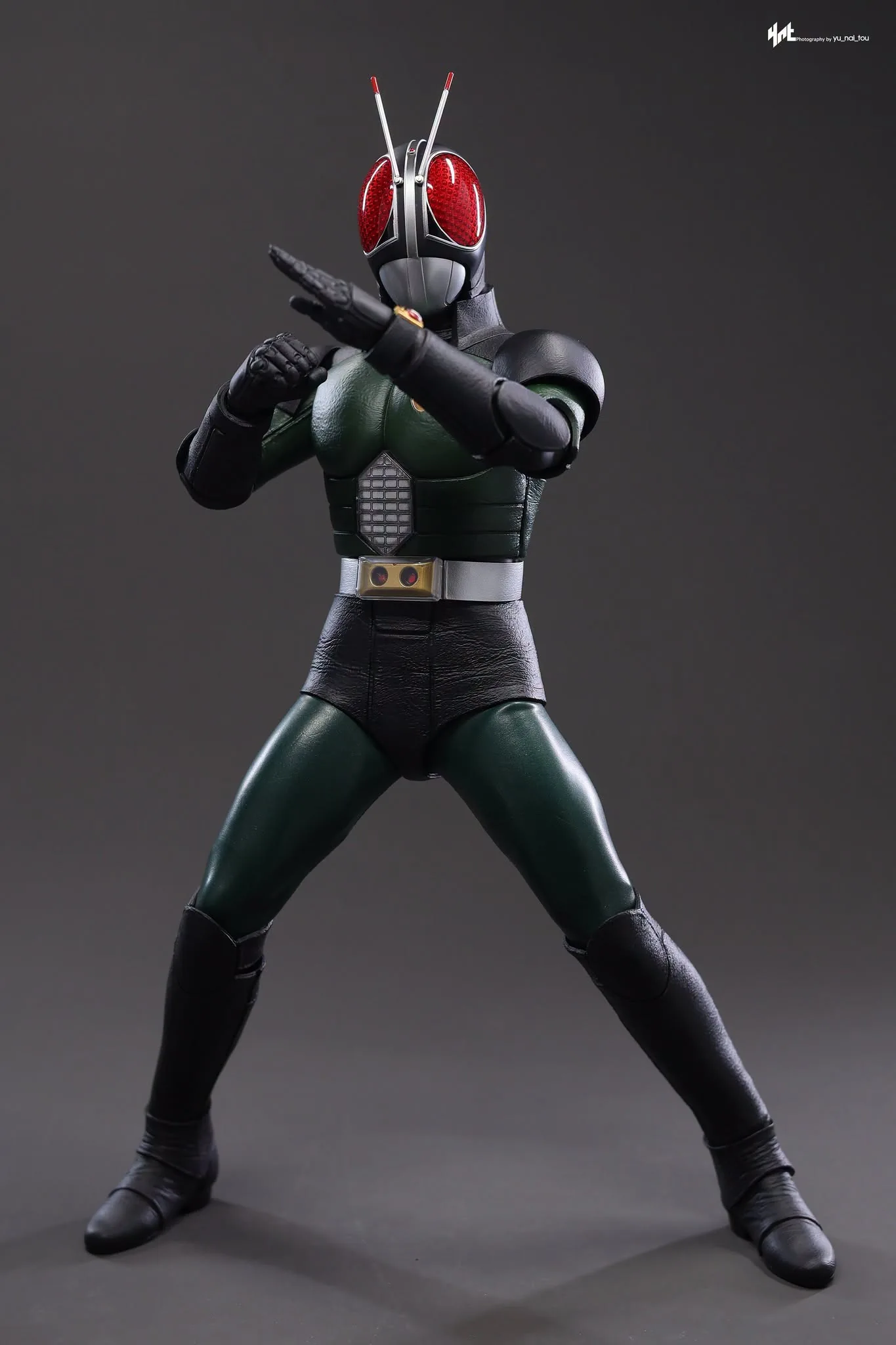 Final production review photo of Hot Toys Kamen Rider Black RX showing the full figure with arms crossed in a transformation pose.