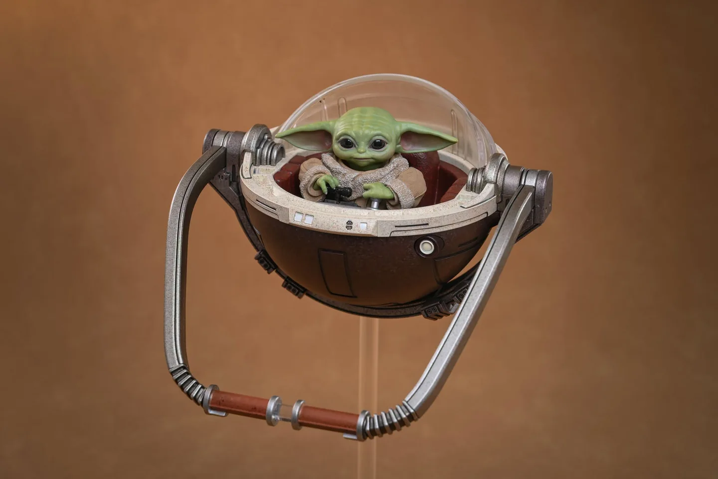 Final production review photo of Hot Toys Mandalorian & Grogu showing Grogu seated in the Deluxe floating pram.