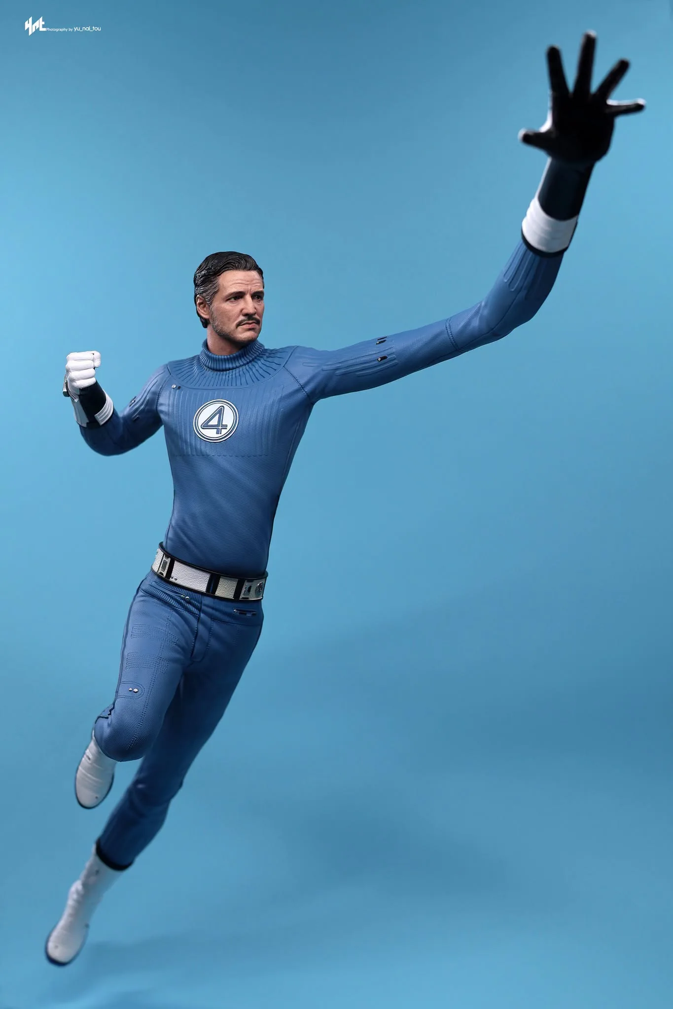 Final production review photo of Hot Toys Mister Fantastic showing the normal fabric-suit body in a raised-arm display pose.
