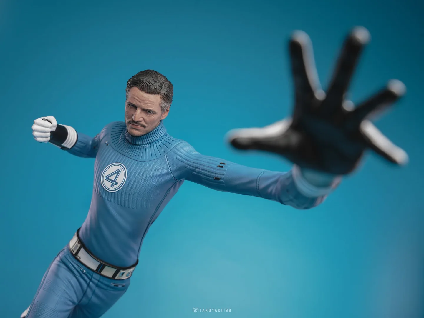 Final production review photo of Hot Toys Mister Fantastic showing the textured blue suit, collar and chest emblem.