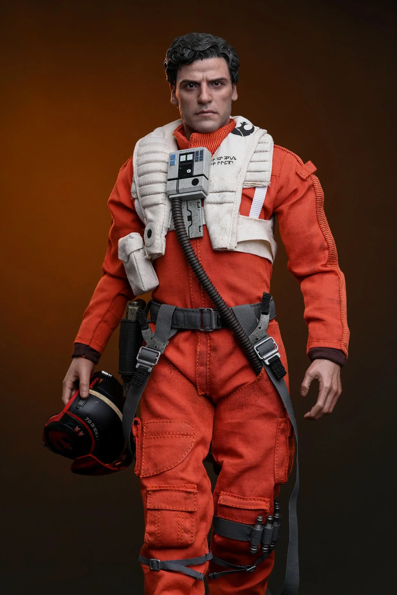 Final production review photo of Hot Toys Poe Dameron showing the full standing figure with helmet in hand.