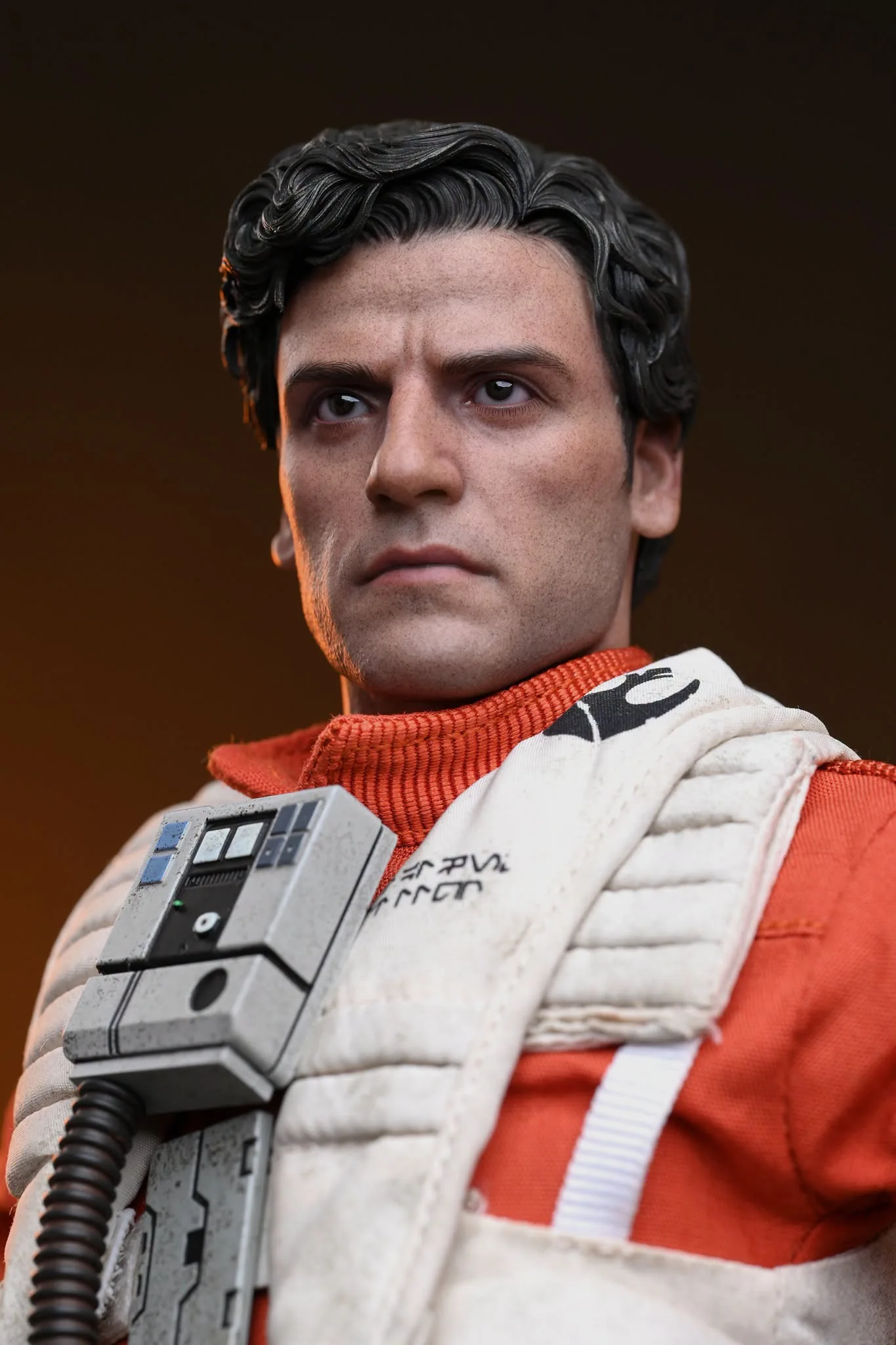 Final production review photo of Hot Toys Poe Dameron showing the Oscar Isaac head sculpt and sculpted hair.