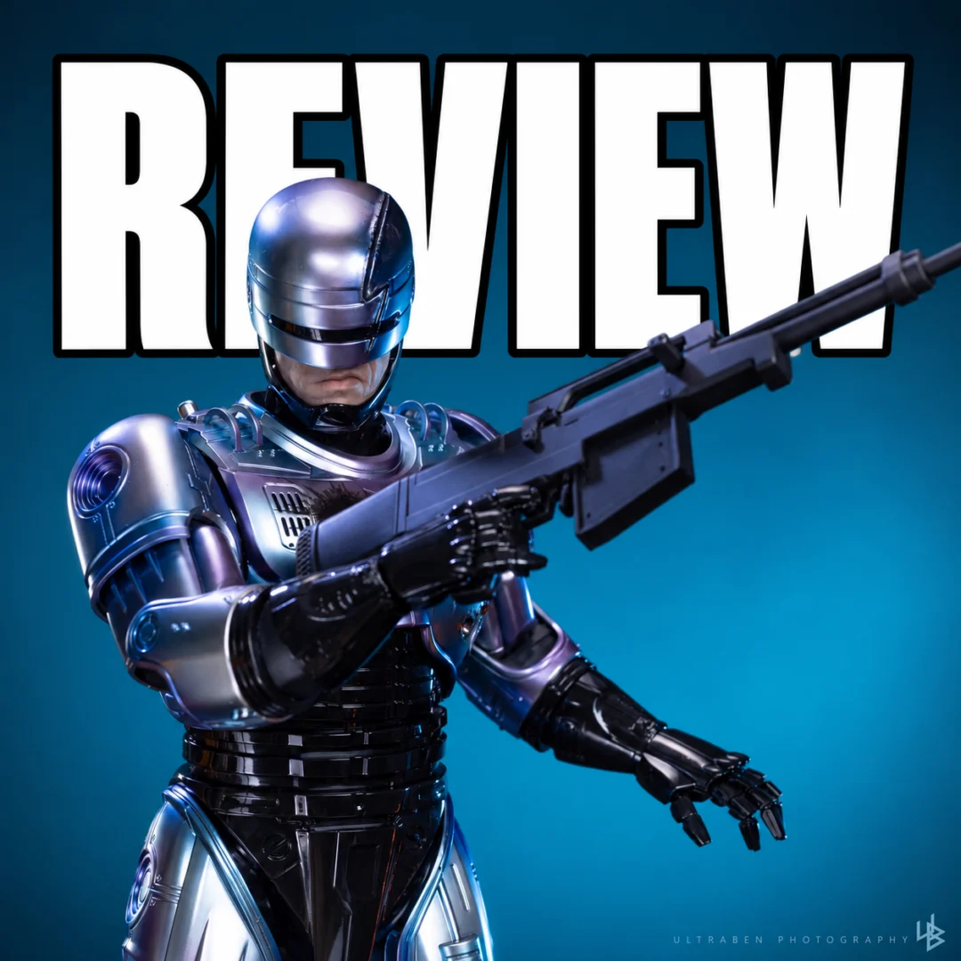 Hot Toys RoboCop 2 final production review photo with blue-purple armor and the Cobra Assault Cannon, with REVIEW lettering behind the figure.