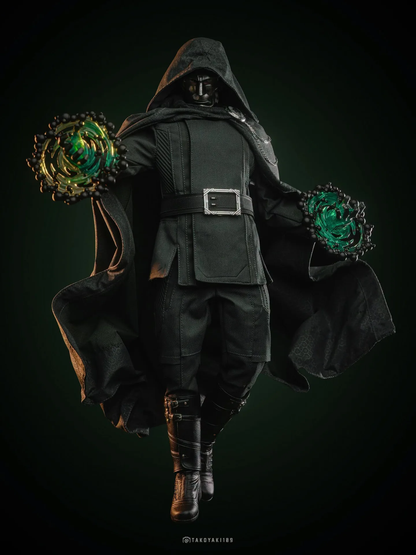Final production review photo of Hot Toys Victor Von Doom showing the included green and black magic effect hands.
