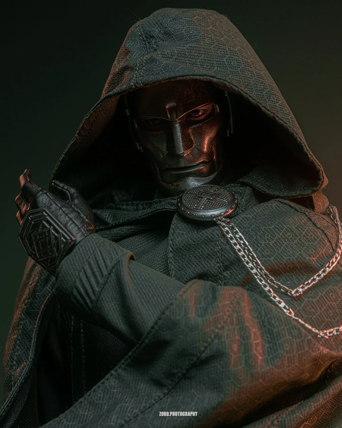 Final production review photo of Hot Toys Victor Von Doom showing the weathered mask, eyes and patterned hood.