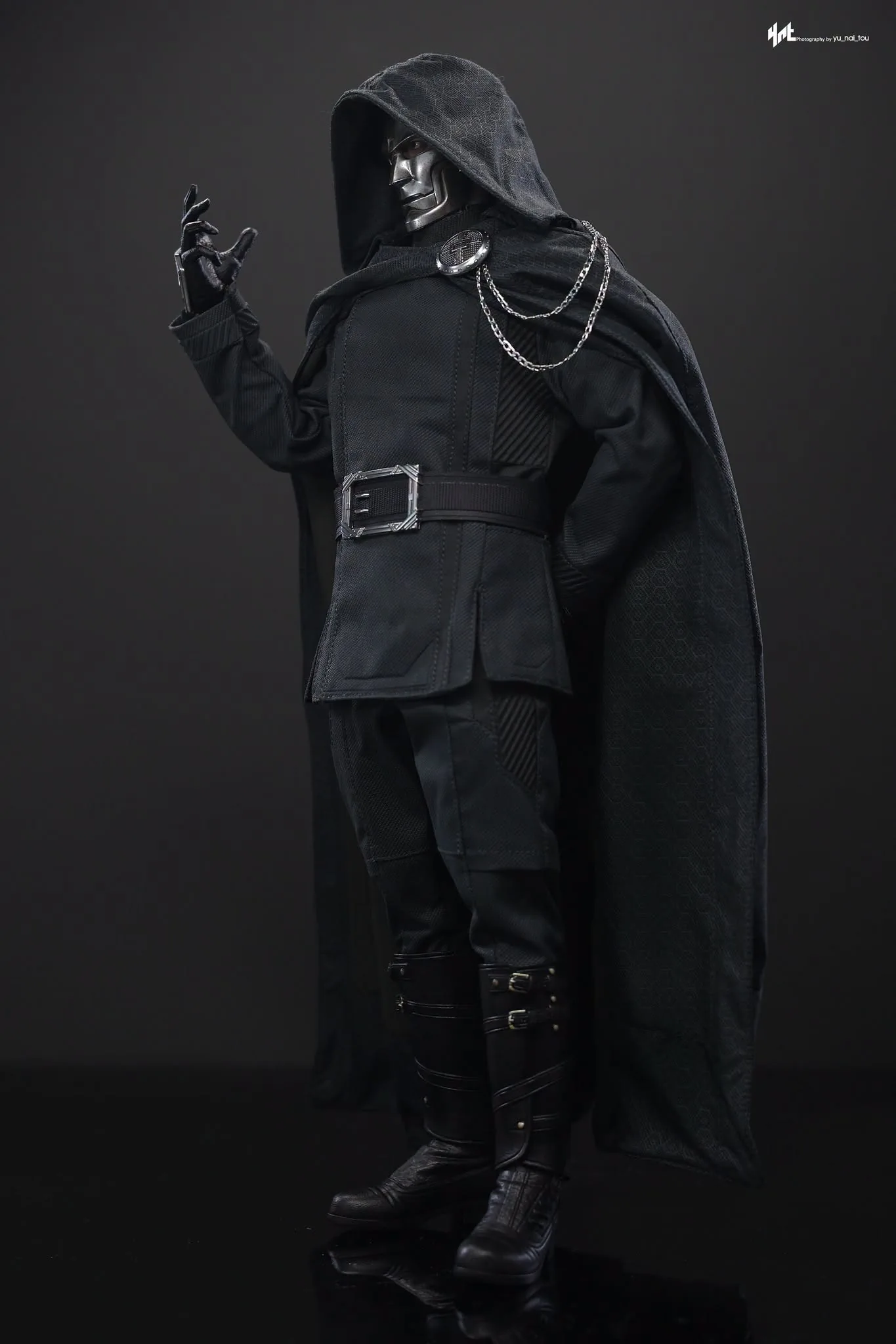 Final production review photo of Hot Toys Victor Von Doom showing Doom standing with one gloved hand raised.